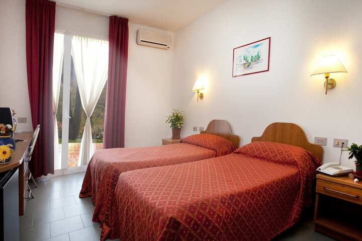 Buitenhof Reizen voor mensen met een verstandelijke beperling - Casa Vacanze Il Girasoli - kamer Buitenhof Reizen voor mensen met een verstandelijke beperling - Casa Vacanze Il Girasoli - kamer