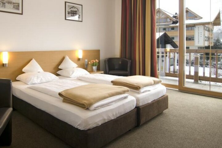 Kirchberg - Slaapkamer Brauwirt - Mundorado begeleide vakanties voor mensen met een lichamelijk beperking