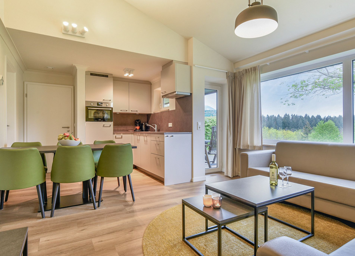 Buitenhof Reizen voor mensen met een verstandelijke beperking - Landal Warsberg - woonkamer Buitenhof Reizen voor mensen met een verstandelijke beperking - Landal Warsberg - woonkamer